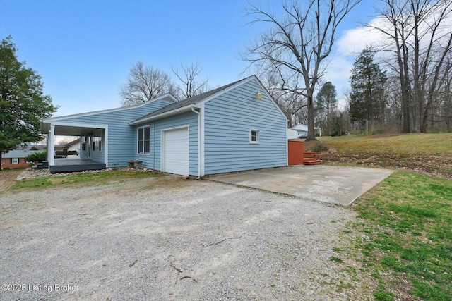 8400 Wisertown Rd, Louisville, KY 40214 - view of side of home with a garage and driveway