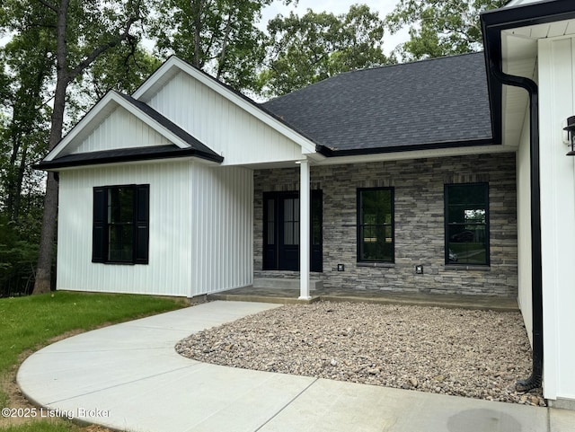 57 Malvern Ct, Brandenburg, KY 40108 - view of front of home with roof with shingles, stone siding, and covered porch