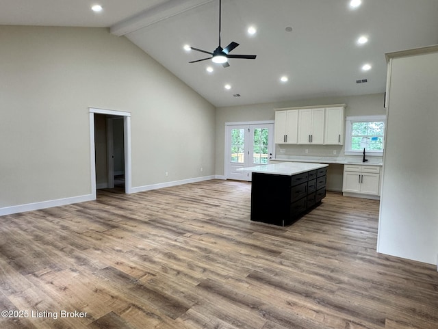 57 Malvern Ct, Brandenburg, KY 40108 - kitchen with healthy amount of natural light, a kitchen island, beamed ceiling, light countertops, and a ceiling fan