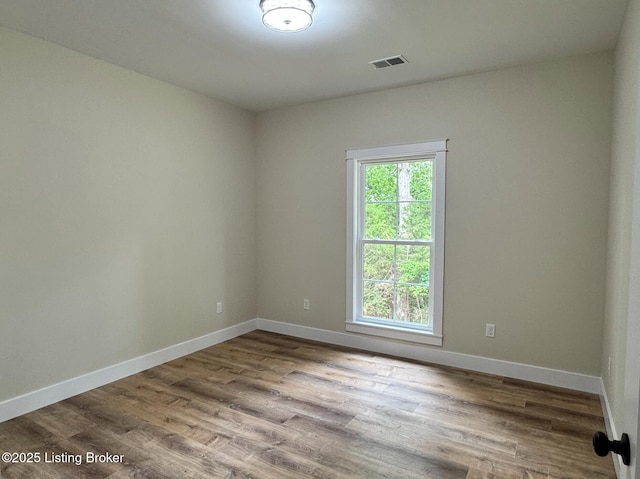 57 Malvern Ct, Brandenburg, KY 40108 - spare room featuring wood finished floors and baseboards