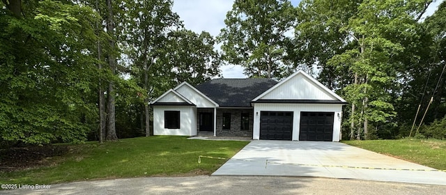 57 Malvern Ct, Brandenburg, KY 40108 - modern farmhouse with an attached garage, driveway, and a front lawn