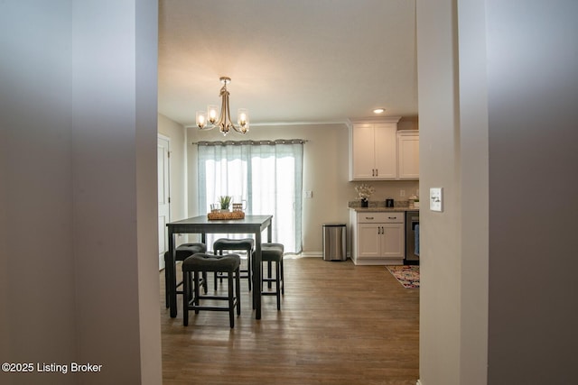 58 Sissy Ct, Elizabethtown, KY 42701 - dining area featuring a chandelier, dark wood-style floors, and bar area