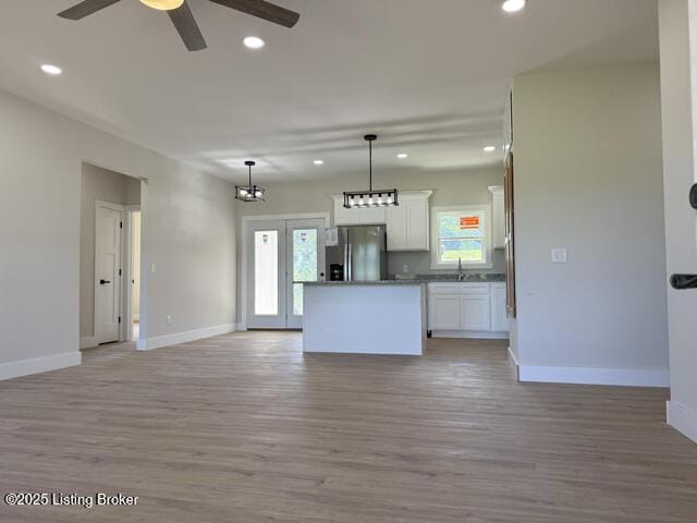 49 Roy Rd, Eastview, KY 42732 - kitchen featuring stainless steel refrigerator with ice dispenser, a ceiling fan, open floor plan, recessed lighting, and baseboards