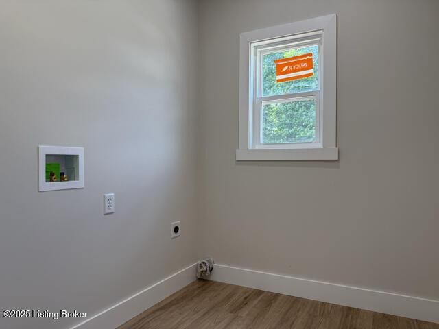 49 Roy Rd, Eastview, KY 42732 - laundry area featuring electric dryer hookup, baseboards, washer hookup, and wood finished floors