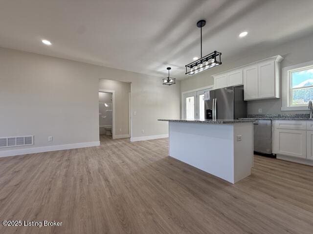 49 Roy Rd, Eastview, KY 42732 - kitchen featuring stainless steel appliances, a center island, white cabinetry, light wood-style floors, and recessed lighting