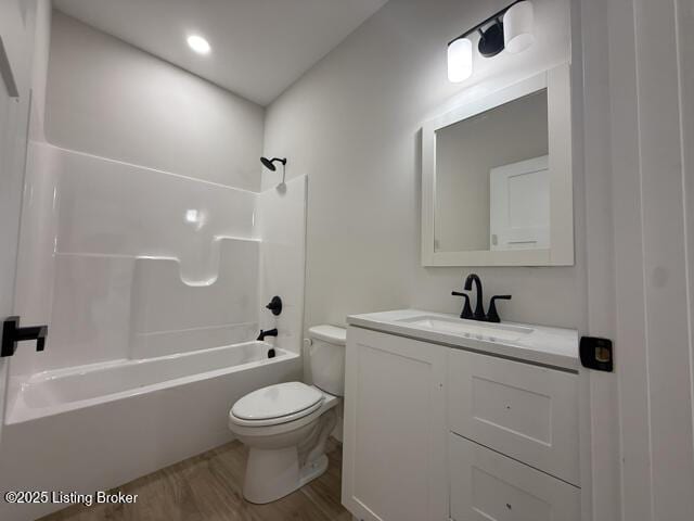 49 Roy Rd, Eastview, KY 42732 - bathroom featuring toilet, vanity, shower / washtub combination, and wood finished floors