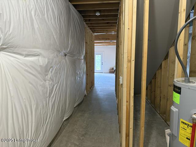 49 Roy Rd, Eastview, KY 42732 - hallway with water heater and concrete flooring