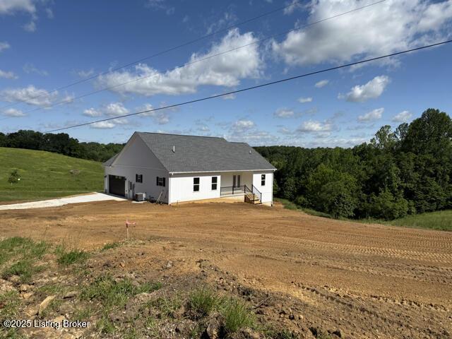 49 Roy Rd, Eastview, KY 42732 - view of side of property with a garage and central air condition unit