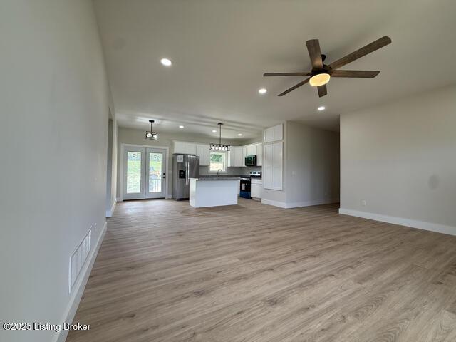 49 Roy Rd, Eastview, KY 42732 - unfurnished living room featuring recessed lighting, ceiling fan, light wood-type flooring, and baseboards