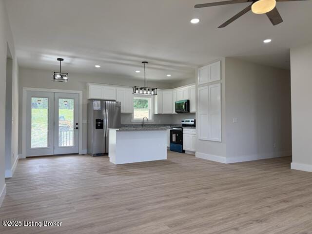 49 Roy Rd, Eastview, KY 42732 - kitchen with stainless steel appliances, open floor plan, baseboards, white cabinets, and recessed lighting