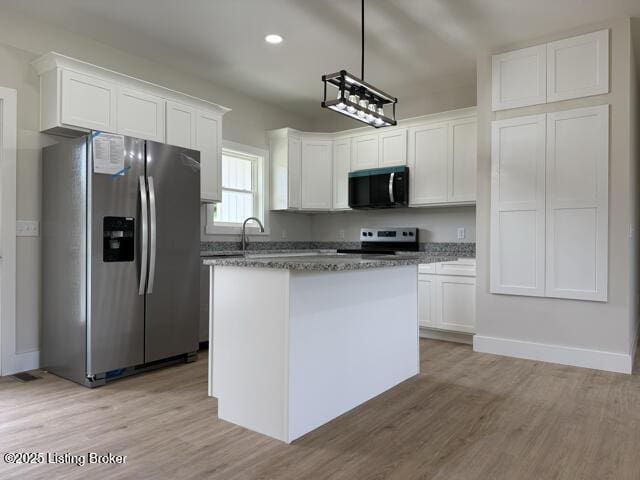 49 Roy Rd, Eastview, KY 42732 - kitchen with appliances with stainless steel finishes, white cabinetry, light wood-type flooring, and recessed lighting