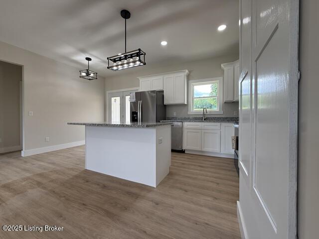 49 Roy Rd, Eastview, KY 42732 - kitchen featuring stainless steel appliances, a center island, white cabinets, light wood-style flooring, and recessed lighting
