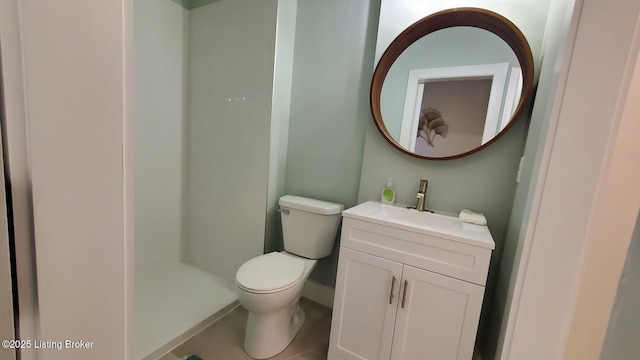 621 E Kentucky St, Louisville, KY 40203 - bathroom with toilet, vanity, and baseboards