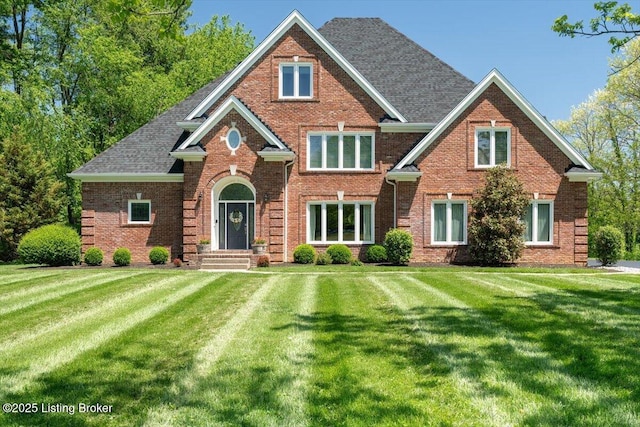 10801 Little Pond Rd, Goshen, KY 40026 - traditional-style home featuring brick siding, a front lawn, and roof with shingles