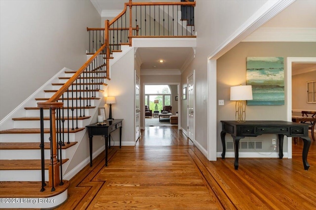 10801 Little Pond Rd, Goshen, KY 40026 - entryway with stairs, wood finished floors, crown molding, a high ceiling, and baseboards