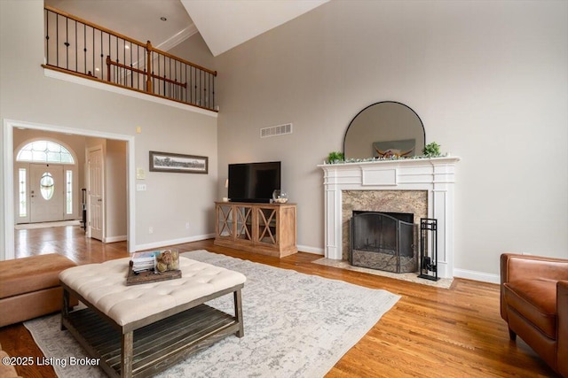 10801 Little Pond Rd, Goshen, KY 40026 - living room with high vaulted ceiling, wood finished floors, a premium fireplace, and baseboards