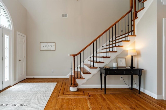 10801 Little Pond Rd, Goshen, KY 40026 - entryway with baseboards, stairs, a towering ceiling, and wood finished floors
