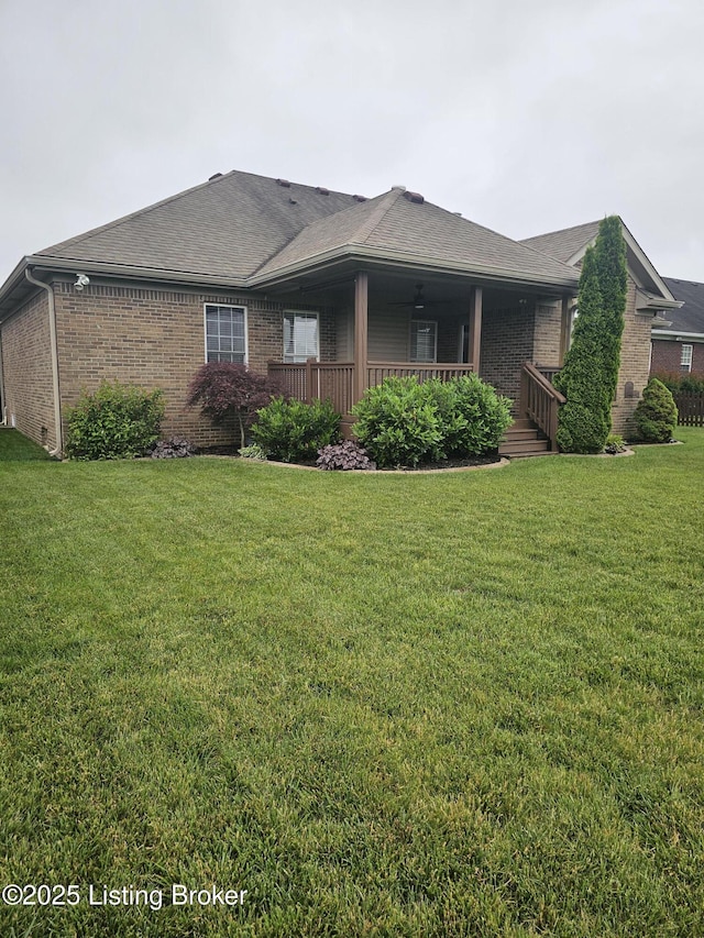 11307 Wind Haven Way, Louisville, KY 40291 - view of property exterior featuring brick siding, a lawn, and a shingled roof