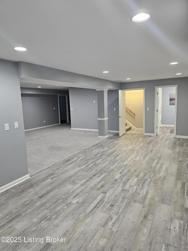 11307 Wind Haven Way, Louisville, KY 40291 - finished below grade area featuring baseboards, recessed lighting, wood finished floors, and stairs
