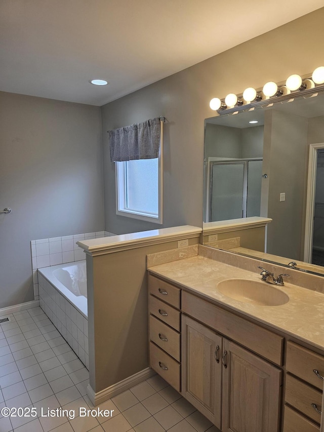 11307 Wind Haven Way, Louisville, KY 40291 - full bath featuring tile patterned floors, vanity, a garden tub, and baseboards