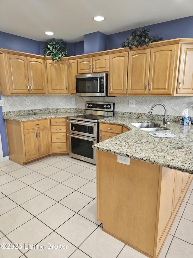 11307 Wind Haven Way, Louisville, KY 40291 - kitchen with appliances with stainless steel finishes, a peninsula, a sink, tasteful backsplash, and recessed lighting