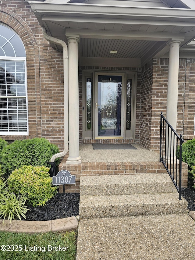 11307 Wind Haven Way, Louisville, KY 40291 - view of exterior entry featuring brick siding and covered porch
