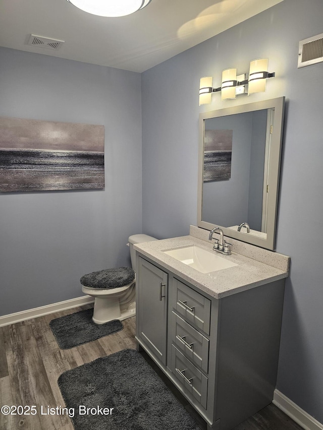 11307 Wind Haven Way, Louisville, KY 40291 - bathroom featuring vanity, toilet, wood finished floors, and baseboards