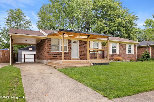 265 N Steedland Dr, Shepherdsville, KY 40229 - ranch-style house featuring concrete driveway, an outbuilding, brick siding, and a carport