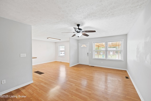 265 N Steedland Dr, Shepherdsville, KY 40229 - empty room with a ceiling fan, light wood-type flooring, baseboards, and a textured ceiling