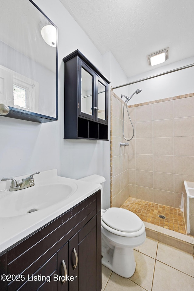 265 N Steedland Dr, Shepherdsville, KY 40229 - bathroom with a tile shower, tile patterned floors, vanity, toilet, and a textured ceiling
