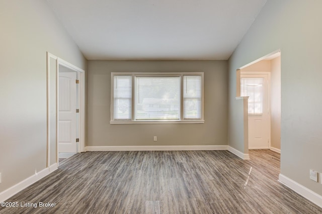 13500 Greystone Ave, Louisville, KY 40272 - spare room with wood finished floors and vaulted ceiling