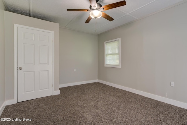 13500 Greystone Ave, Louisville, KY 40272 - unfurnished bedroom with dark carpet and a ceiling fan