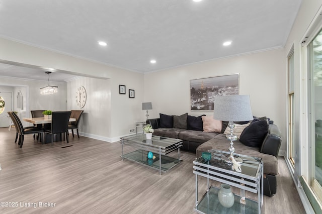 4328 Dohn Ave, Louisville, KY 40216 - living area featuring wood finished floors, recessed lighting, baseboards, and ornamental molding