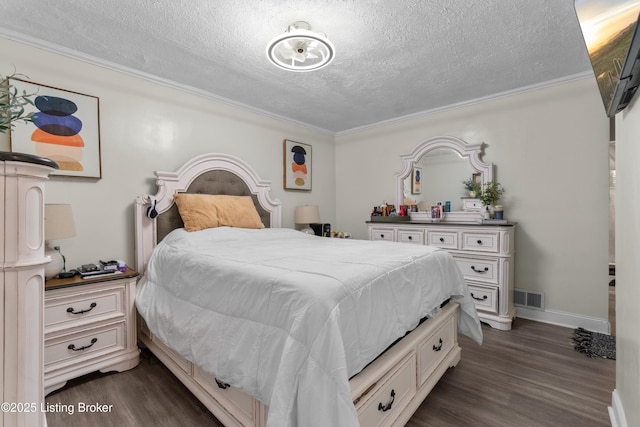 4328 Dohn Ave, Louisville, KY 40216 - bedroom featuring dark wood-style flooring, a textured ceiling, ornamental molding, and baseboards