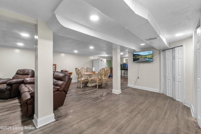 4328 Dohn Ave, Louisville, KY 40216 - living room featuring wood finished floors, baseboards, a textured ceiling, and recessed lighting