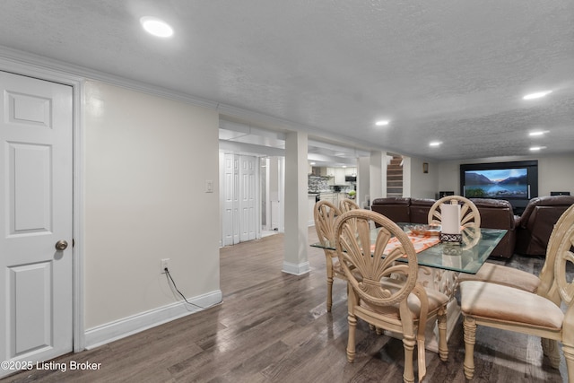 4328 Dohn Ave, Louisville, KY 40216 - dining room featuring wood finished floors, baseboards, a textured ceiling, and recessed lighting