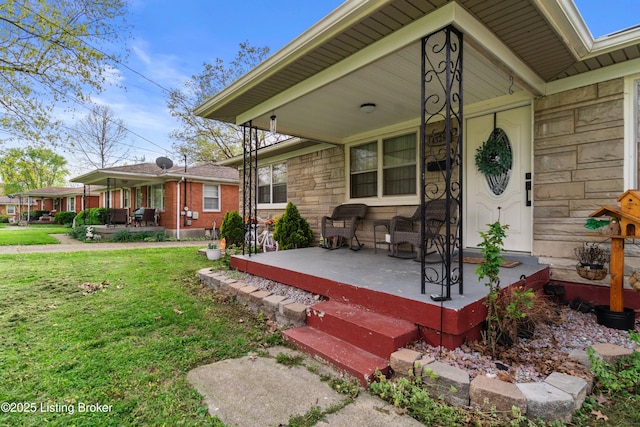 4328 Dohn Ave, Louisville, KY 40216 - property entrance with a porch, stone siding, and a lawn