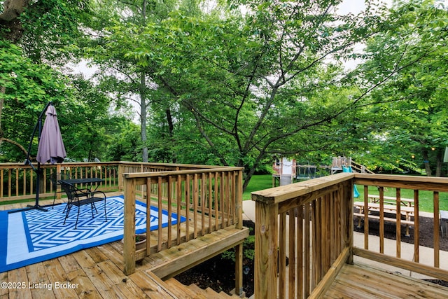 11805 Cedardale Rd, Anchorage, KY 40223 - wooden terrace featuring view of wooded area and a playground