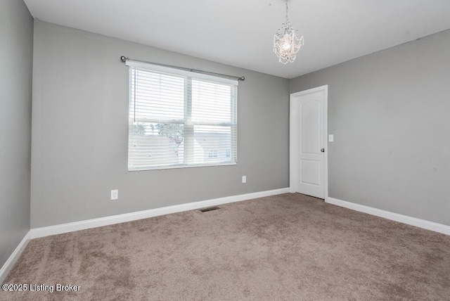 9006 Big Boulder Dr, Louisville, KY 40291 - carpeted spare room with baseboards and a chandelier