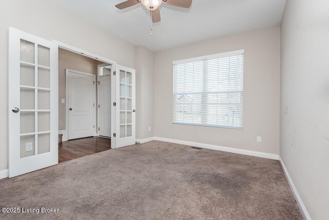 9006 Big Boulder Dr, Louisville, KY 40291 - unfurnished bedroom featuring french doors, carpet flooring, baseboards, and a ceiling fan