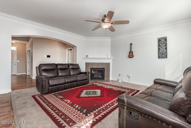 9006 Big Boulder Dr, Louisville, KY 40291 - living area featuring ornamental molding, ceiling fan, arched walkways, a fireplace, and baseboards