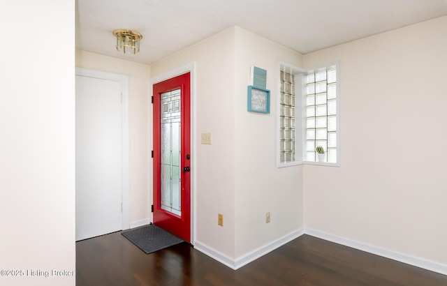 1031 Thruston Ave, Louisville, KY 40217 - foyer entrance featuring dark wood-style flooring and baseboards