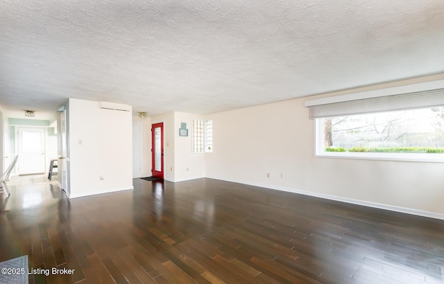 1031 Thruston Ave, Louisville, KY 40217 - unfurnished room featuring wood finished floors, baseboards, and a textured ceiling