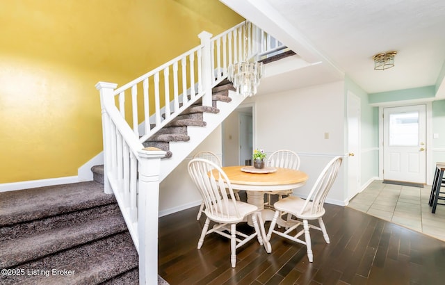1031 Thruston Ave, Louisville, KY 40217 - dining area with stairs, wood finished floors, and baseboards