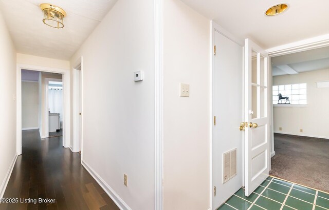 1031 Thruston Ave, Louisville, KY 40217 - corridor with baseboards and dark colored carpet