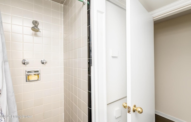 1031 Thruston Ave, Louisville, KY 40217 - bathroom featuring tiled shower and ornamental molding