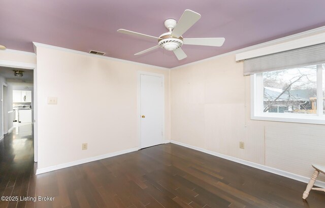 1031 Thruston Ave, Louisville, KY 40217 - spare room with ceiling fan, dark wood-style flooring, baseboards, and crown molding