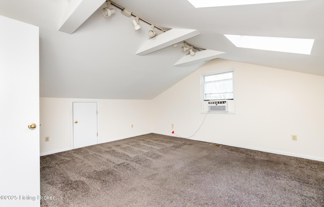 1031 Thruston Ave, Louisville, KY 40217 - bonus room featuring a skylight, cooling unit, carpet floors, vaulted ceiling, and baseboards