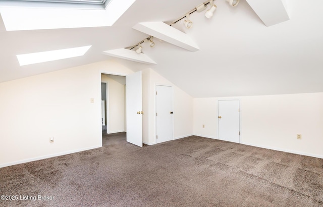 1031 Thruston Ave, Louisville, KY 40217 - additional living space with a skylight, vaulted ceiling, carpet floors, and baseboards