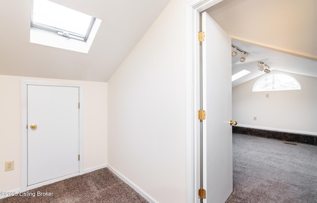 1031 Thruston Ave, Louisville, KY 40217 - bonus room featuring a skylight, vaulted ceiling, dark carpet, and baseboards